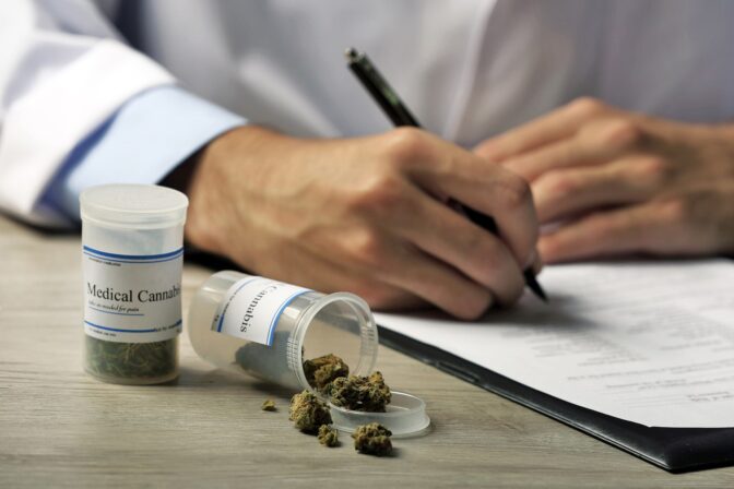 doctor-writing-prescription-blank-bottle-with-medical-cannabis-table-close-up-min